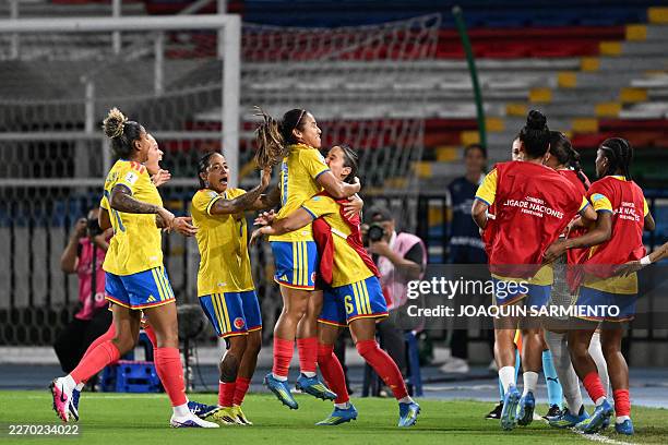 Colombia's midfielder Leicy Santos celebrates with teammates after scoring the equalising goal from the penalty spot during the CONMEBOL Nations...