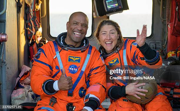 In this handout photo provided by NASA, NASA astronaut Victor Glover, Artemis II pilot, left, and NASA astronaut Christina Koch, Artemis II mission...
