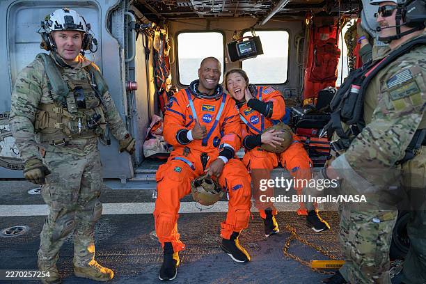 In this handout photo provided by NASA, NASA astronaut Victor Glover, Artemis II pilot, left, and NASA astronaut Christina Koch, Artemis II mission...