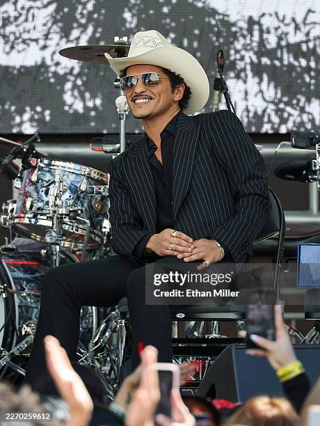 Bruno Mars reacts onstage after a parade honoring his impact on Las Vegas entertainment on April 10, 2026 in Las Vegas, Nevada. As part of the event,...