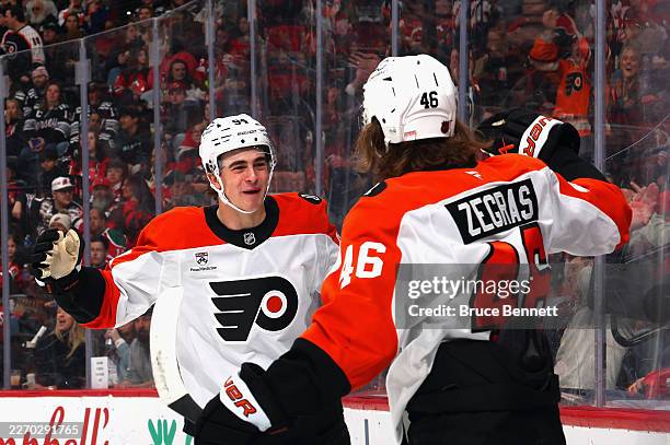Trevor Zegras of the Philadelphia Flyers celebrates his powerplay goal against the New Jersey Devils at 3:36 of the first period on an assist from...