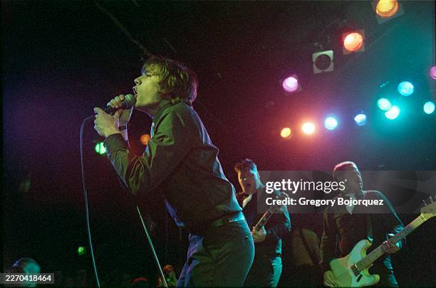 Performing with Swedish garage rock band The Hives in May, 2002 in Los Angeles, California.