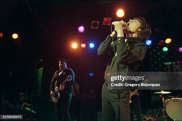 Performing with Swedish garage rock band The Hives in May, 2002 in Los Angeles, California.