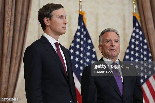 Jared Kushner, left, and Steve Witkoff, Special Envoy for Peace Missions listen as Vice President JD Vance speaks during a news conference after...