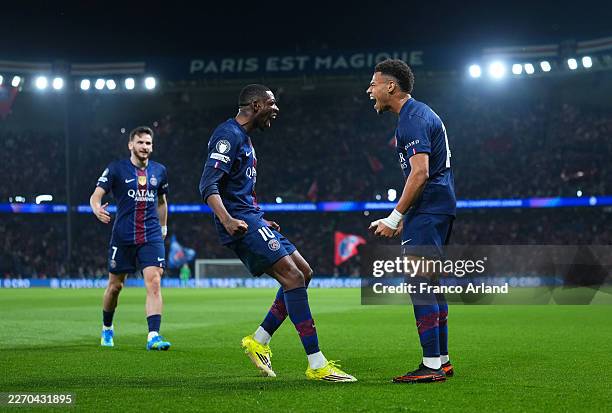 Desire Doue of Paris Saint-Germain celebrates scoring his team's first goal with teammate Ousmane Dembele during the UEFA Champions League 2025/26...