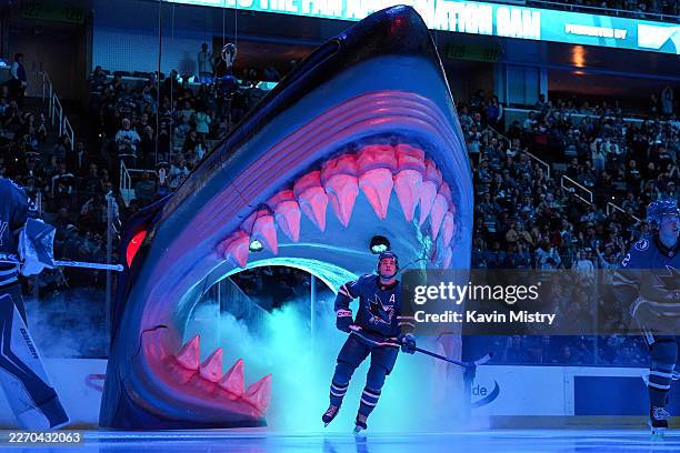 Macklin Celebrini of the San Jose Sharks takes the ice through the Shark Head before the game against the Vancouver Canucks at SAP Center on April...