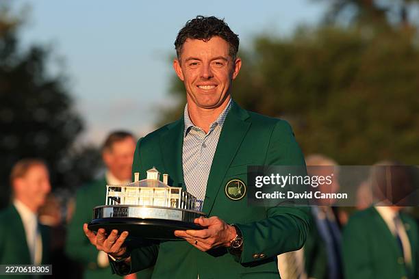 Rory McIlroy of Northern Ireland holds the Masters trophy after being awarded the Green Jacket following his victory during the final round of the...