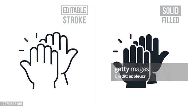 two hands giving each other a high five - editable stroke and solid icons - high five hands stock illustrations