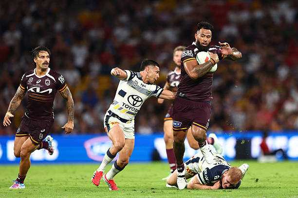 Payne Haas of the Broncos is tackled during the round six NRL match between the Brisbane Broncos and North Queensland Cowboys at Suncorp Stadium on...