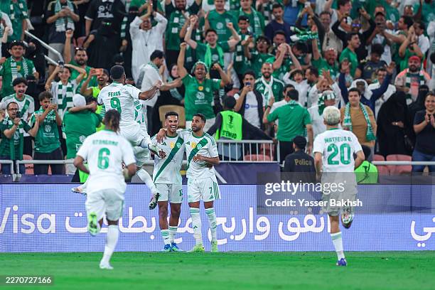 Riyad Mahrez of Al Ahli celebrates after scoring the first goal during the AFC Champions League Elite Round of 16 match between Al Ahli and Al Duhail...