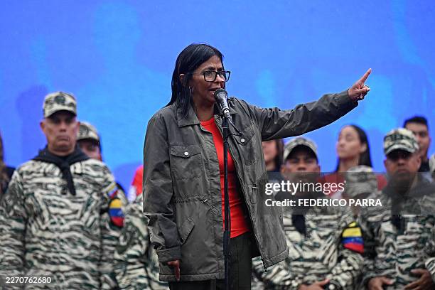 Venezuela's interim President Delcy Rodriguez delivers a speech during a civil-military parade marking the 24th anniversary of late Venezuelan...