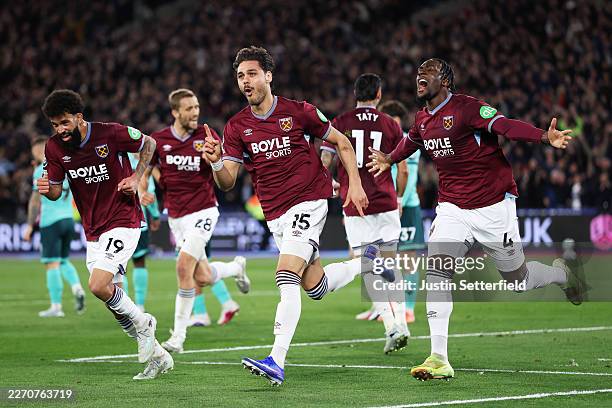 Konstantinos Mavropanos of West Ham United celebrates scoring his team's first goal with Axel Disasi during the Premier League match between West Ham...