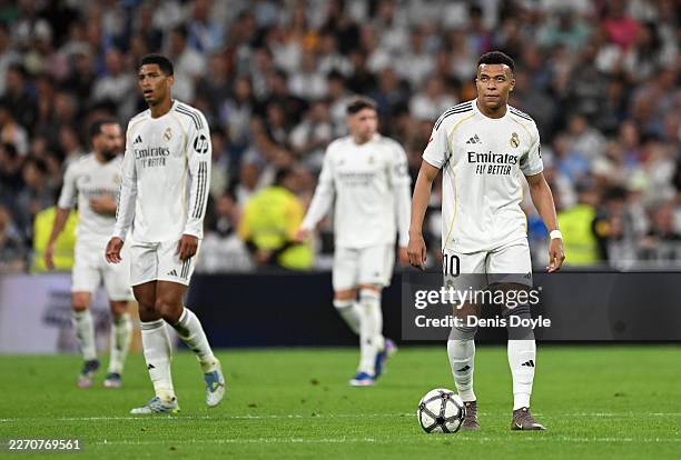 Kylian Mbappe of Real Madrid looks dejected after Thomas Lemar of Girona FC scores his team's first goal during the LaLiga EA Sports match between...