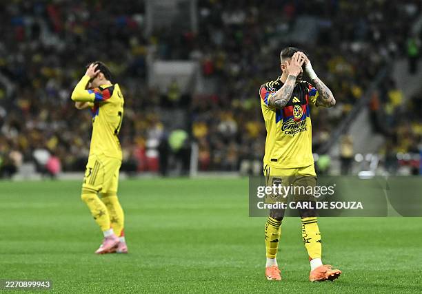 America's Brazilian midfielder Raphael Veiga and Uruguayan midfielder Brian Rodriguez react during the CONCACAF Champions Cup quarterfinal football...