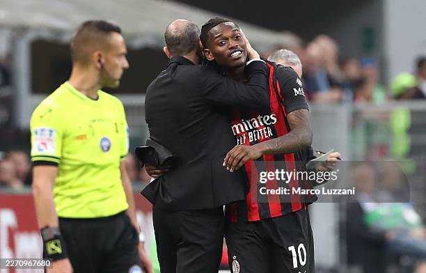 Milan coach Massimiliano Allegri embrace his player Rafael Leao after substitution during the Serie A match between AC Milan and Udinese Calcio at...