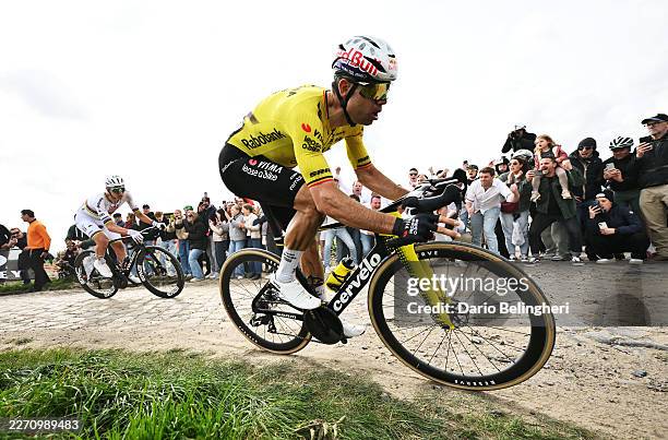 Tadej Pogacar of Slovenia and UAE Team Emirates - XRG and Wout van Aert of Belgium and Team Visma | Lease a Bike compete in the breakaway passing...