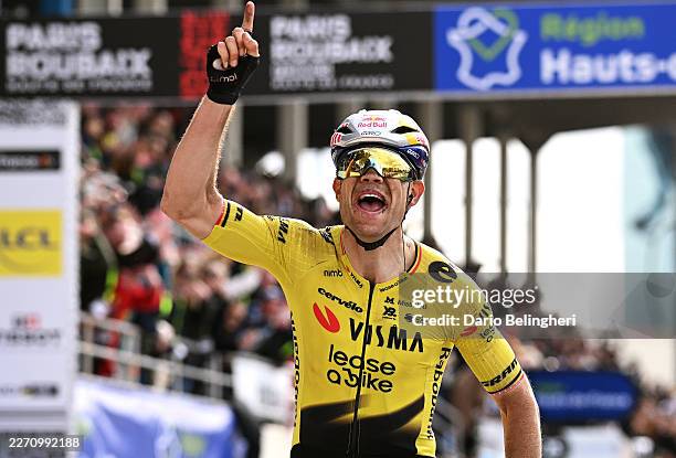 Wout van Aert of Belgium and Team Visma | Lease a Bike celebrates at finish line as race winner in the Roubaix Velodrome - Andre Petrieux during the...