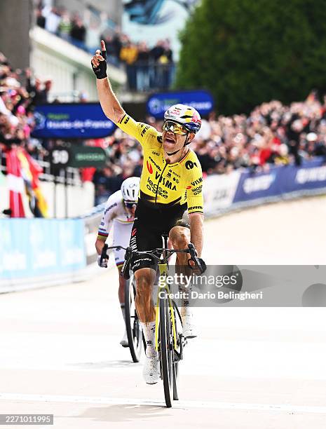 Wout van Aert of Belgium and Team Visma | Lease a Bike celebrates at finish line as race winner in the Roubaix Velodrome - Andre Petrieux during the...