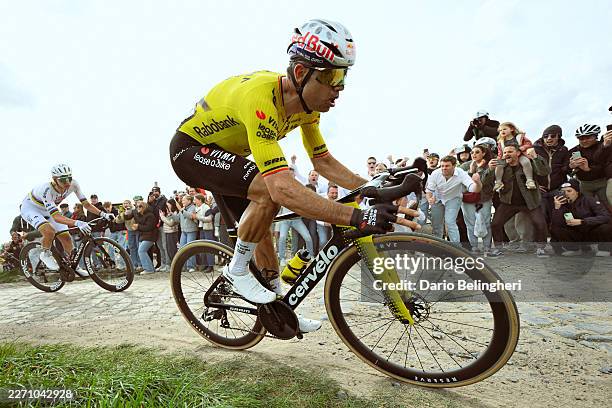 Wout van Aert of Belgium and Team Visma | Lease a Bike and Tadej Pogacar of Slovenia and UAE Team Emirates - XRG compete in the breakaway passing...