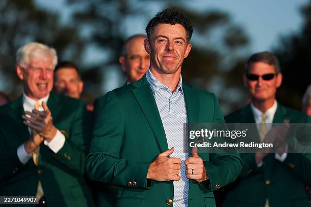Rory McIlroy of Northern Ireland reacts after being awarded the Green Jacket during the Green Jacket Ceremony after winning the final round of the...