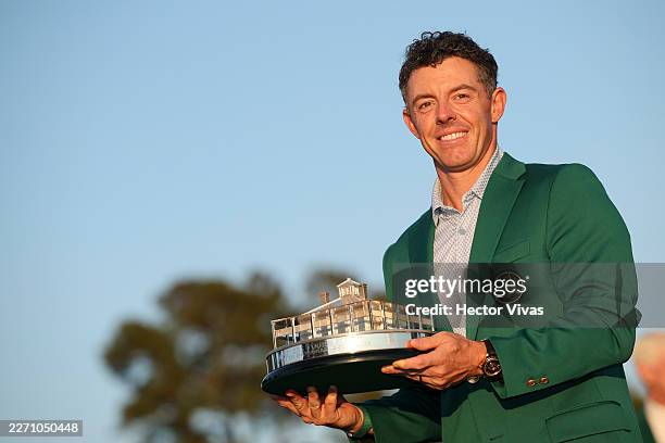Rory McIlroy of Northern Ireland poses with the Masters trophy during the Green Jacket Ceremony after winning the final round of the 2026 Masters...