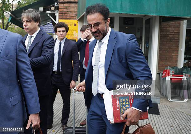 Argentine football legend Diego Maradona's former doctor Leopoldo Luque arrives at a courthouse to testify during a hearing in the trial over...