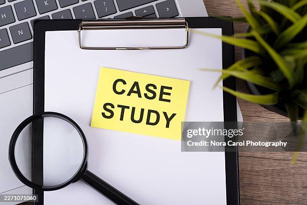 clipboard, magnifying glass and adhesive note with text case study - case study stock pictures, royalty-free photos & images