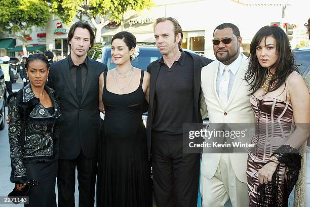 Cast members Jada Pinkett Smith, Keanu Reeves, Carrie-Anne Moss, Hugo Weaving, Laurence Fishburne and Monica Bellucci arrive at the premiere of "The...