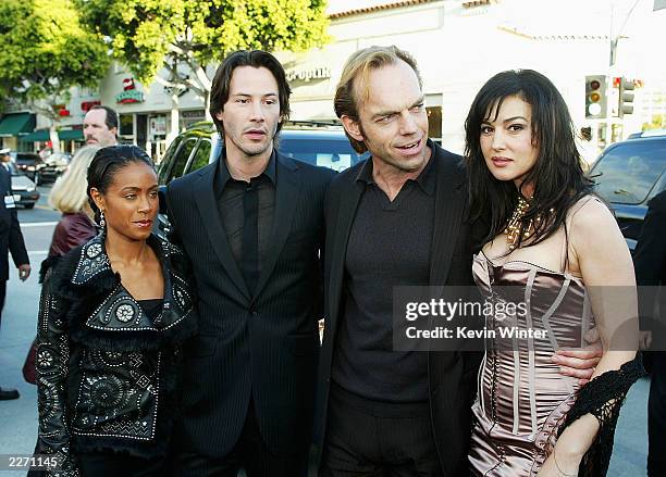 Cast members Jada Pinkett Smith, Keanu Reeves, Hugo Weaving, and Monica Bellucci arrive at the premiere of "The Matrix Reloaded" at the Village...