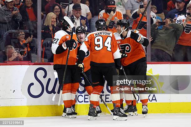 Trevor Zegras of the Philadelphia Flyers celebrates his power-play goal with teammates during the second period against the Carolina Hurricanes at...