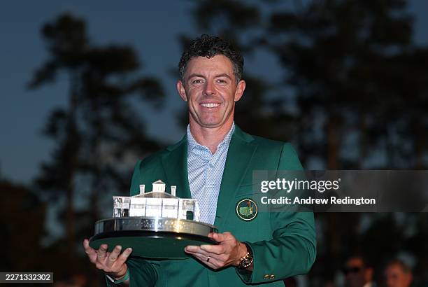 Rory McIlroy of Northern Ireland poses with the Masters trophy during the Green Jacket Ceremony after winning during the final round of the 2026...