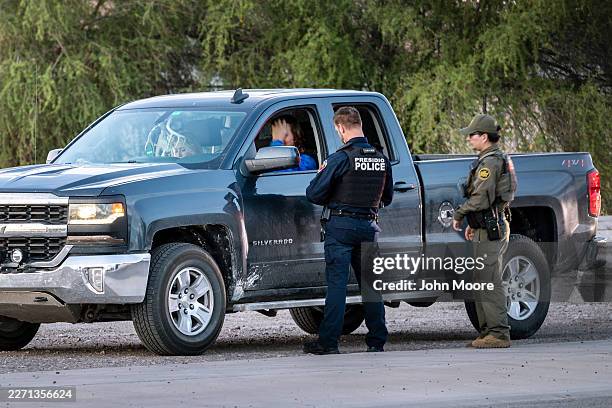 Border Patrol agent accompanies a Presidio police officer on a traffic stop on April 10, 2026 near Presidio, Texas. Trump Administration plans to...