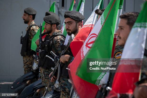 Iranian police officers stand guard outside a square during a pro-government rally commemorating Iran's female fighters, known as the country's...