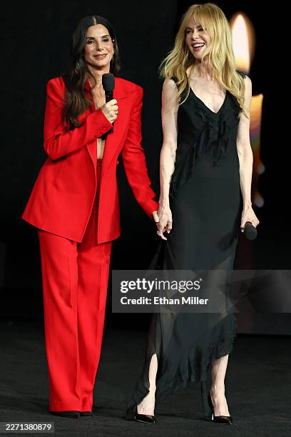 Sandra Bullock and Nicole Kidman promote the upcoming film "Practical Magic 2" at the Warner Bros. Pictures presentation at The Dolby Colosseum at...