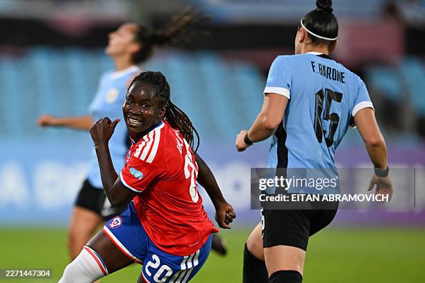 Chile's midfielder Mary Valencia celebrates scoring her team's first goal during the CONMEBOL Nations League Women football match between Uruguay and...