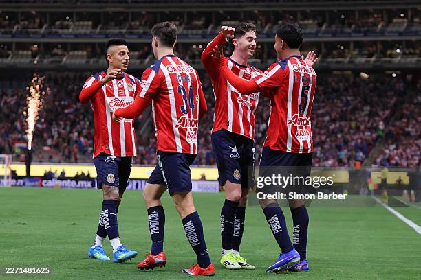 Bryan Gonzalez of Chivas celebrates with teammates after scoring the team's first goal during the 15th round match between Chivas and Puebla as part...