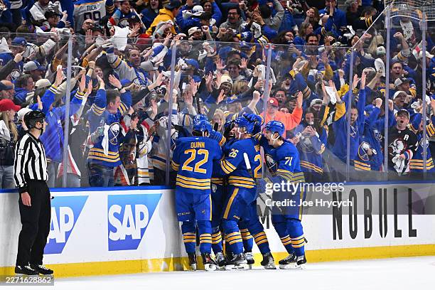 Mattias Samuelsson of the Buffalo Sabres celebrates with teammates after scoring during the third period in Game One of the First Round of the 2026...