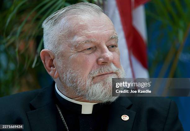 Archbishop Thomas Wenski, Archdiocese of Miami, attends a press conference about the cancellation of an $11 million federal contract with Catholic...