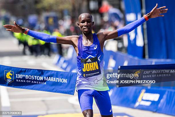 Kenyan long-distance runner John Korir crosses the finish line as he wins the men's division during the 130th Boston Marathon on April 20 in Boston,...