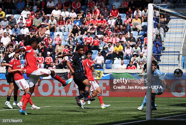 Yanis Musuayi of Club Brugge scores his team's third goal during the UEFA Youth League Semi-Final match between SL Benfica and Club Brugge KV at...