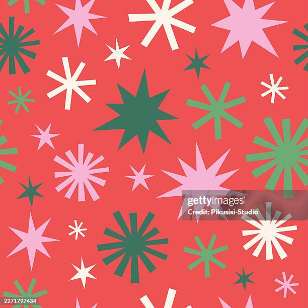 seamless christmas pattern with colorful abstract stars and snowflakes on red background - cute stock illustrations