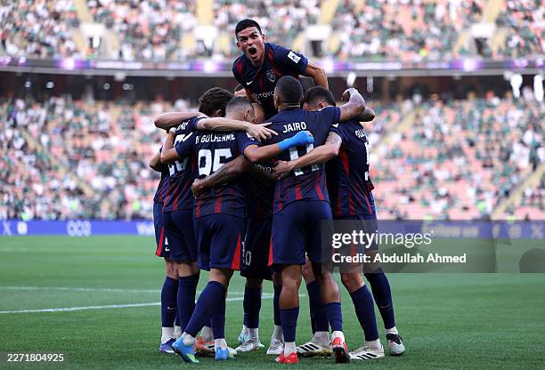 Jonathan Silva of Johor Darul Ta'zim celebrates with teammates after Ali Majrashi of Al Ahli scored an own goal, Al Ahli's first during the AFC...