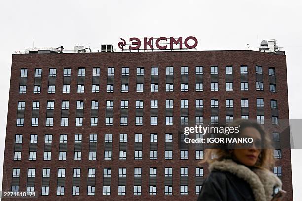 The logo of Eksmo, Russia's largest publisher, sits on top of the publishing house's central office building in Moscow on April 21, 2026. Russian...