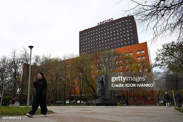 The logo of Eksmo, Russia's largest publisher, sits on top of the publishing house's central office building in Moscow on April 21, 2026. Russian...