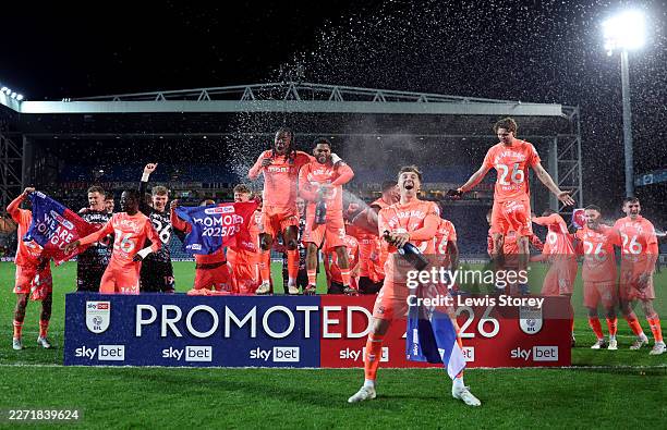 The Coventry City team celebrate their promotion following the Sky Bet Championship match between Blackburn Rovers and Coventry City at Ewood Park on...