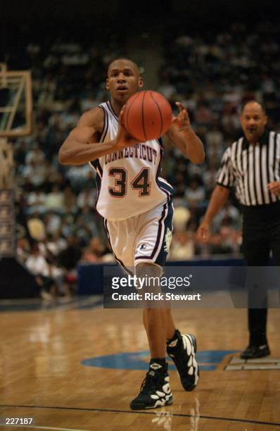 Guard Ray Allen of Conneticut University passes the ball during the Huskies 88-75 win over Boston College at the Gampel Pavilion in Storrs,...