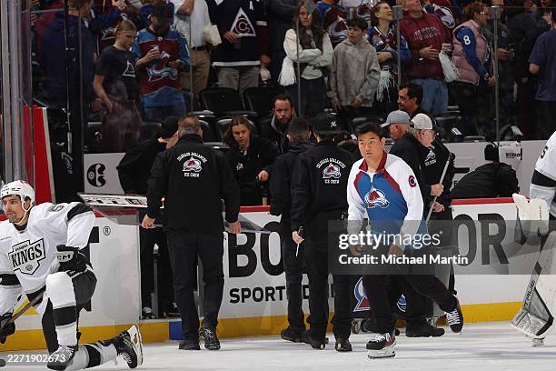 Ice crew for the the Colorado Avalanche fixes a pane of glass that was broken in the second period against the Los Angeles Kings in Game Two of the...