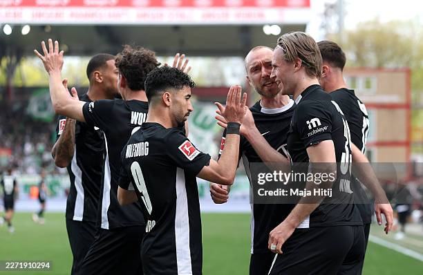 Patrick Wimmer of VfL Wolfsburg celebrates scoring his team's first goal during the Bundesliga match between 1. FC Union Berlin and VfL Wolfsburg at...