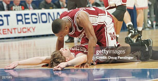 Darryl Wilson congratulates Whit Hughes of Mississippi State after making a play in the Bulldogs 73-63 win over Cincinnati to earn a Final Four birth...