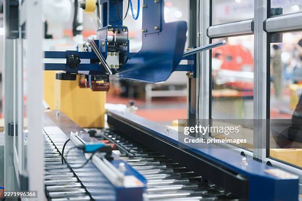 robotic standard multipurpose arm manipulator robot controler managing cardboard box warehouse storage racks filled inventory management. - wrapping arm stock pictures, royalty-free photos & images